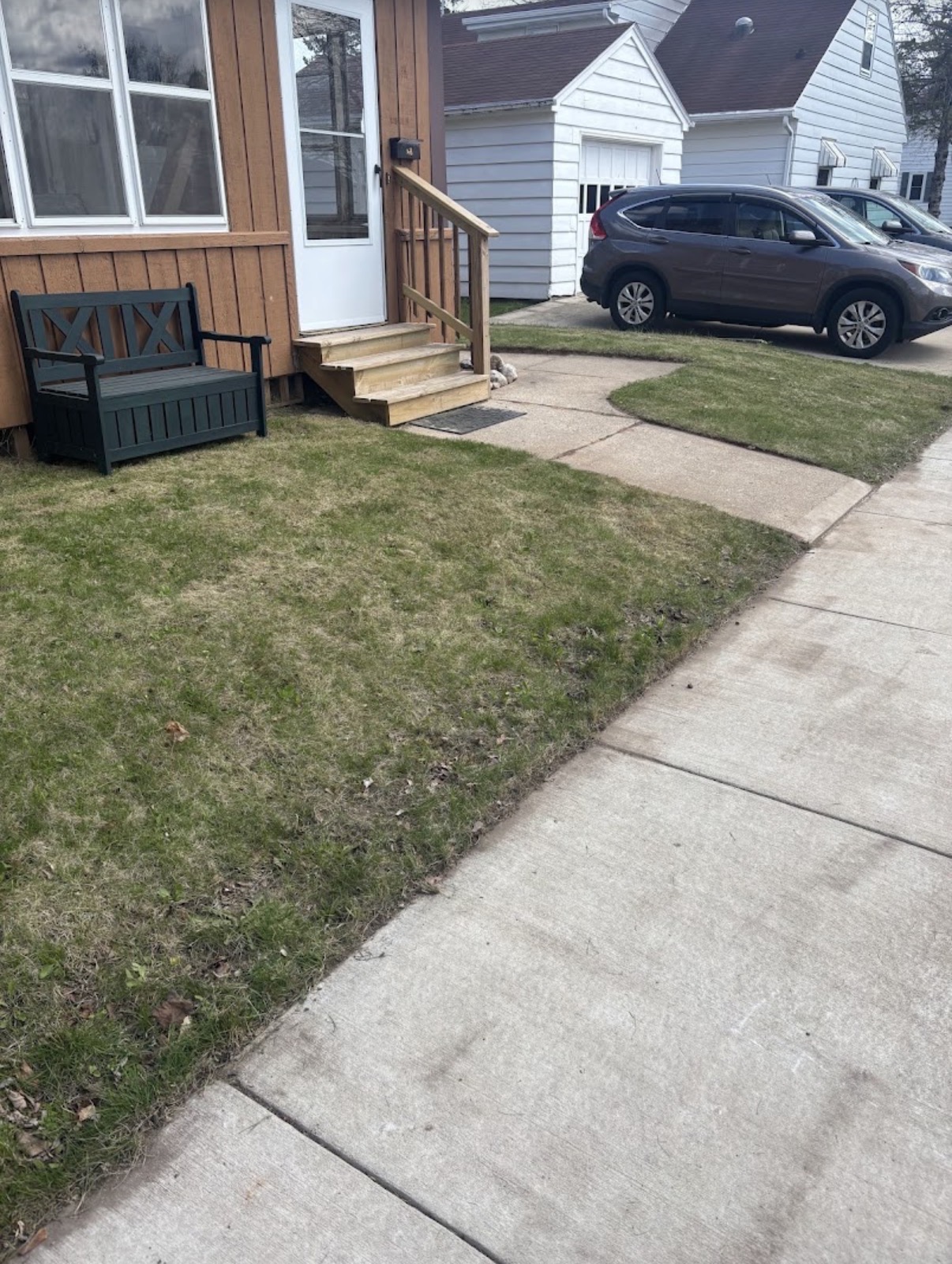 Front lawn and walkway cleaned up with new steps and tidy edges
